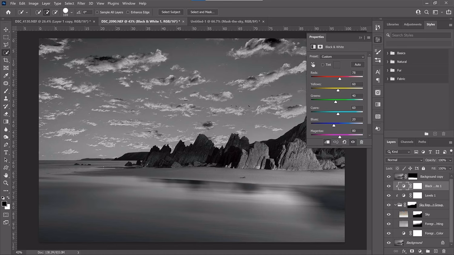 How do you adjust whites and blacks in Photoshop?