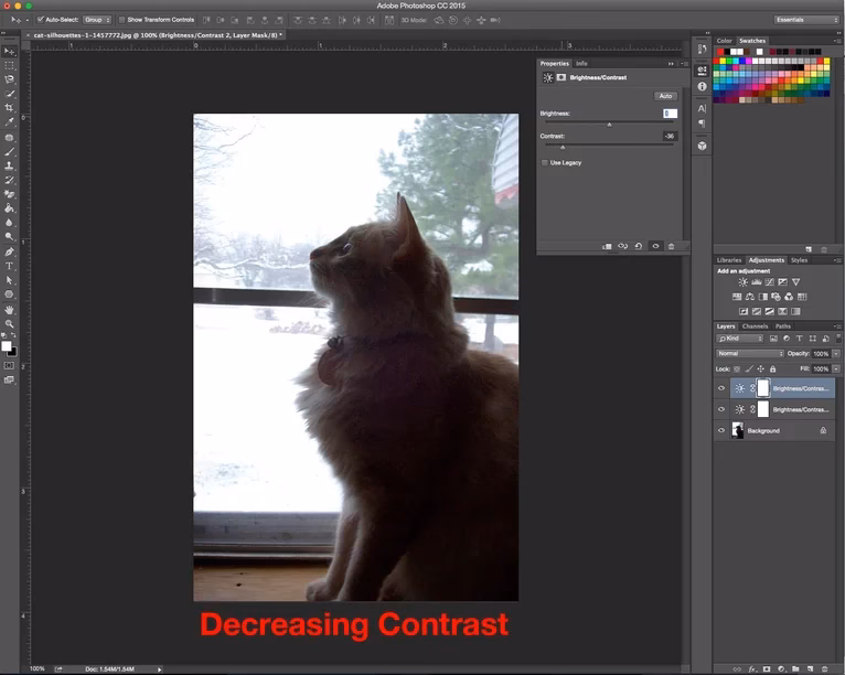 How do I change the contrast of a layer in Photoshop?